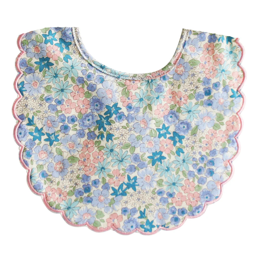 Alimrose Scallop Bib Liberty Blue. Floral patterned bib on a white background