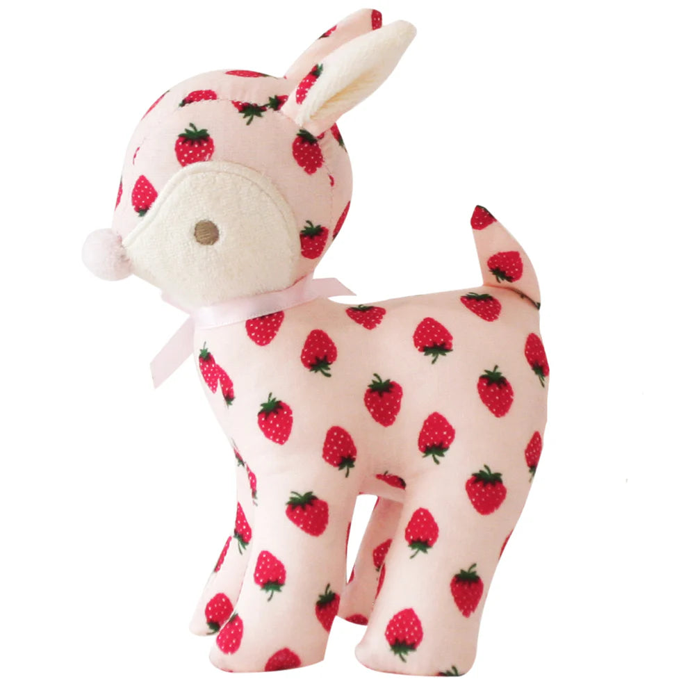 Stuffed animal with strawberry pattern on a white background