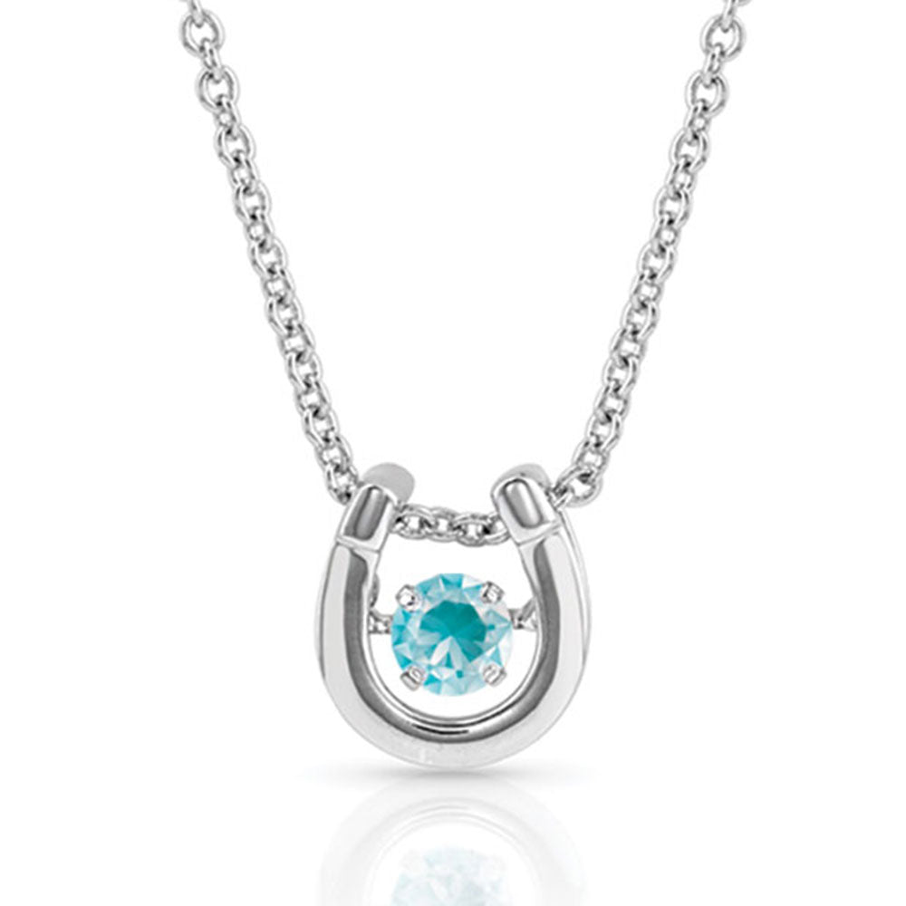 Montana Silversmiths Dancing Birthstone Horseshoe Necklace. A silver-toned horseshoe necklace with a birthstone gemstone in the center, displayed against a white background.