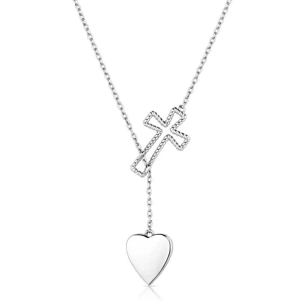 Silver necklace with a heart pendant and cross on a white background