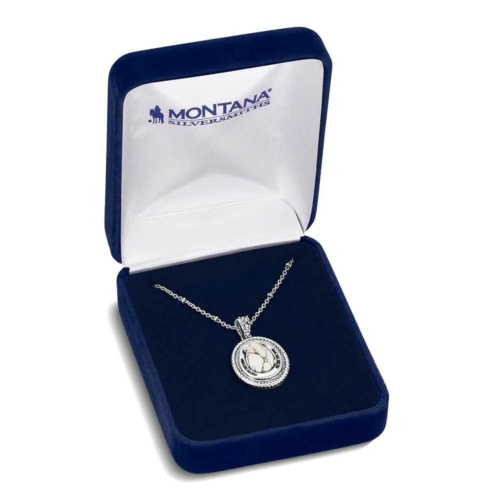Silver necklace in a Montana Silversmiths box on a white background