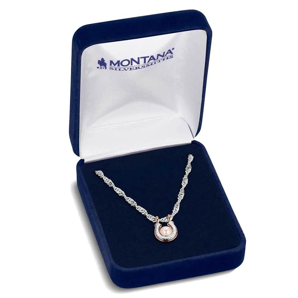 Silver necklace with a pendant in a Montana Silversmiths box on a white background