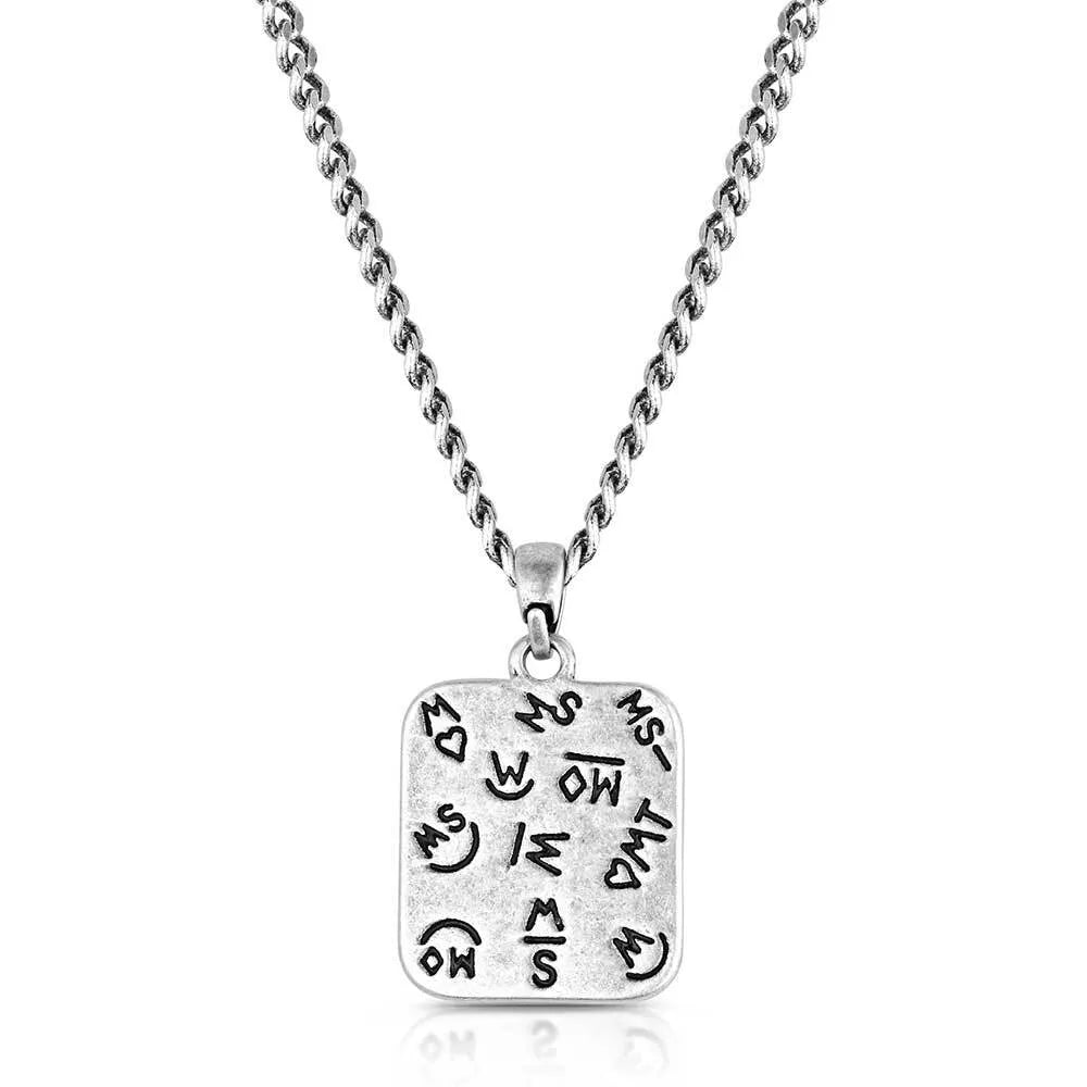 Silver necklace with a square pendant on a white background