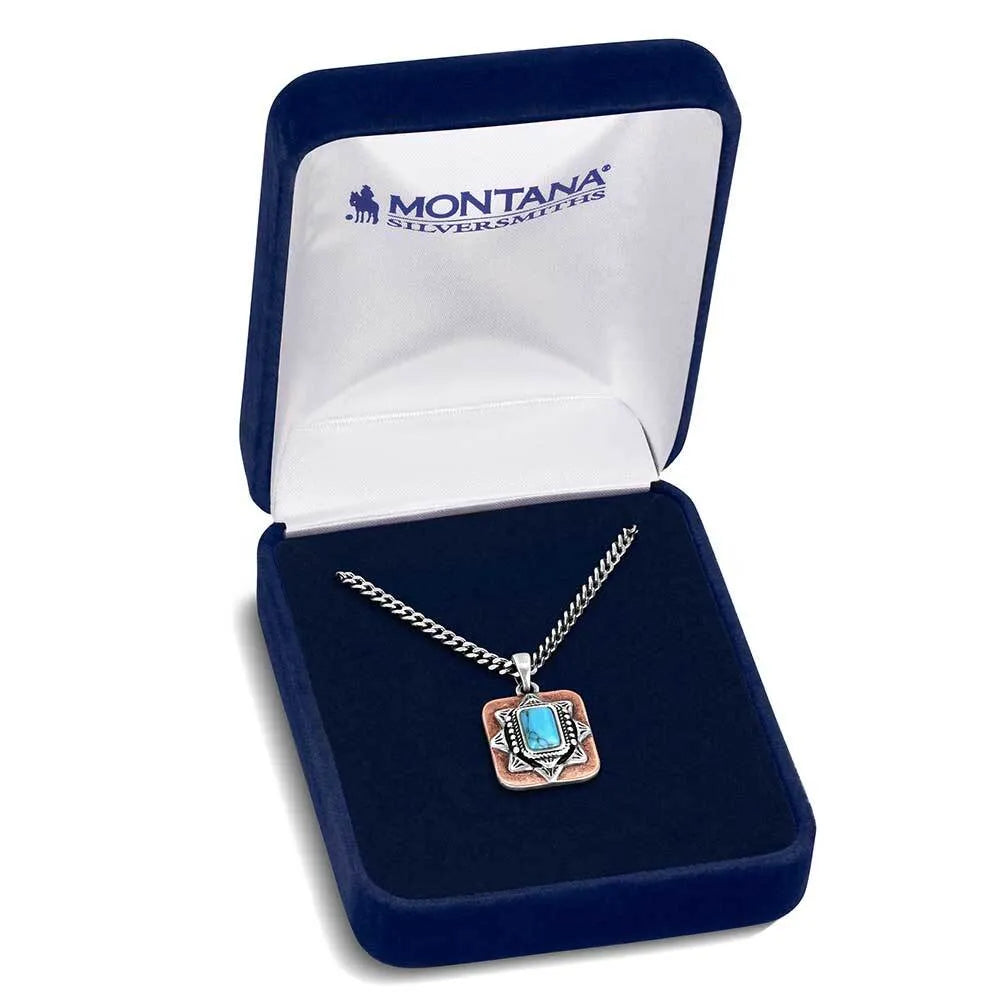 Necklace with a blue gemstone pendant in a Montana Silversmiths box on a white background