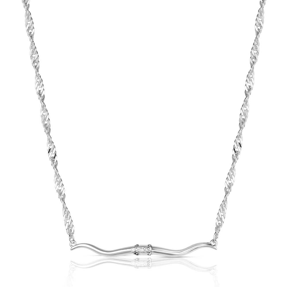 Silver necklace with a subtle design on a white background