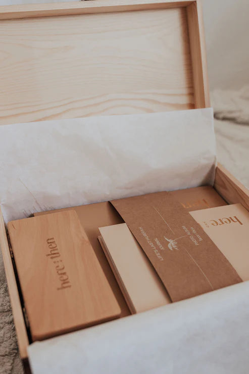 Here And Then Box - Burnt. Wooden box with stationery items inside, including envelopes and a card.