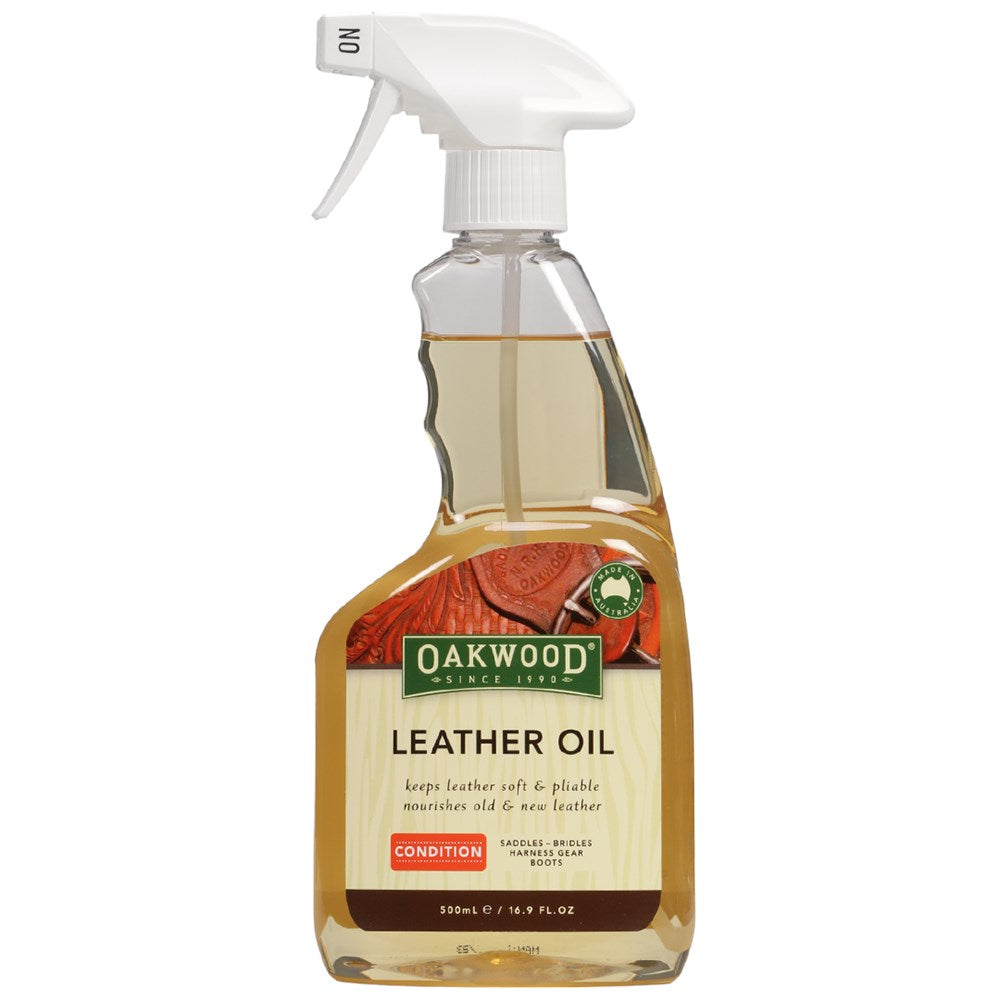Oakwood Leather Oil. A bottle of Oakwood Leather Oil with a spray pump. The label shows the brand name and the product name, along with an image of a leather saddle being treated with the oil.