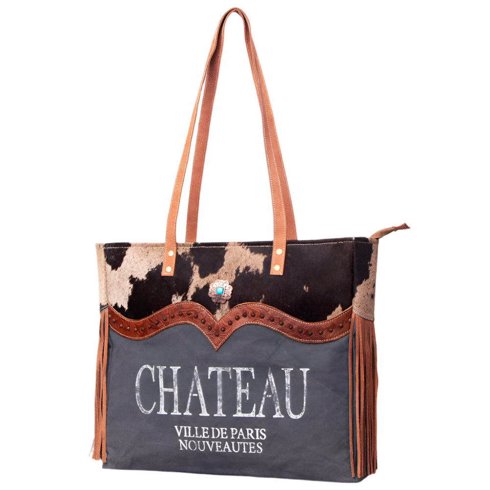 American Darling canvas and leather weekend bag with a 'CHATEAU' print on the front, brown straps, and a floral embossed leather detail.