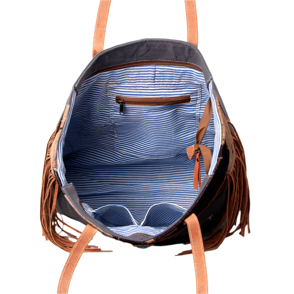 American Darling canvas and leather weekend bag with straiped inside and pockets on a white background