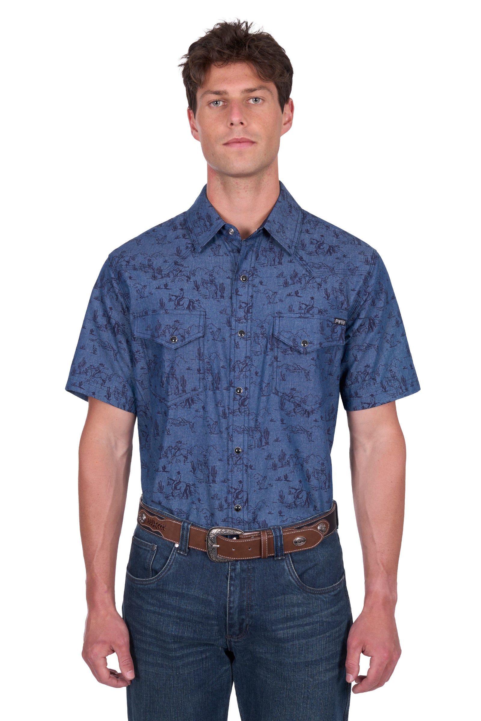 Pure Western Men's Travis S/S Western Shirt. Man wearing a blue patterned shirt and jeans on a white background