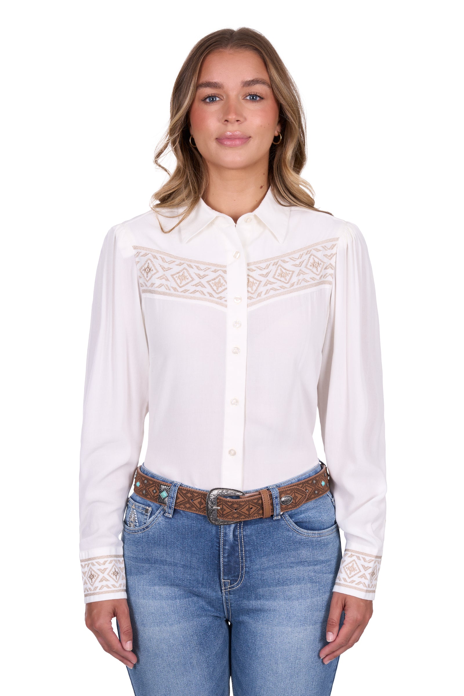 Pure Western Women's Monica L/S Western Shirt. Woman wearing a white blouse with lace details and blue jeans on a white background