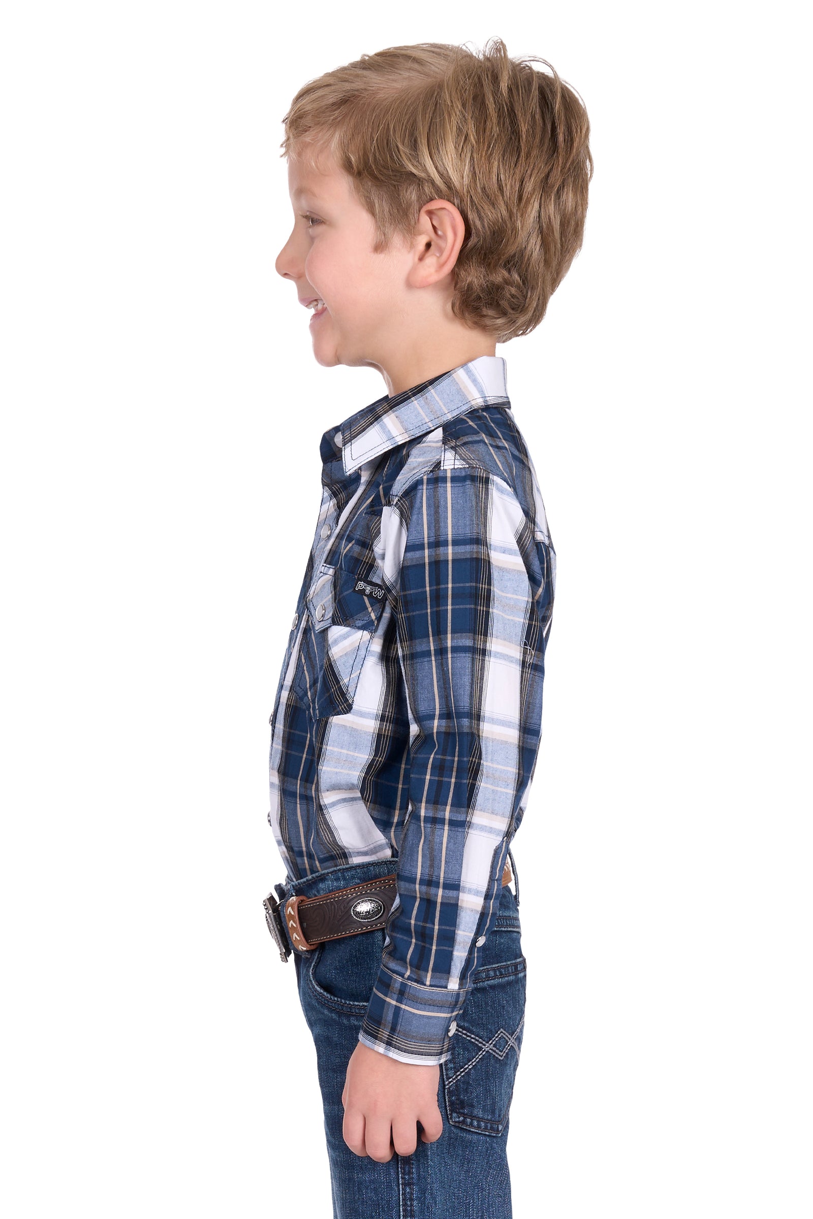 Pure Western Boy's Nicholas L/S Western Shirt. Child wearing a blue plaid shirt and jeans on a white background