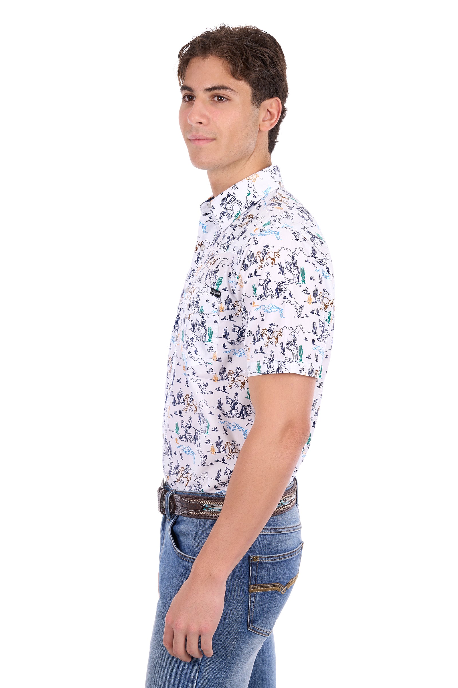 A man shown in profile wearing a short-sleeve button-up shirt with a dense multicolor graphic print on a white base, paired with blue jeans, against a plain white background.