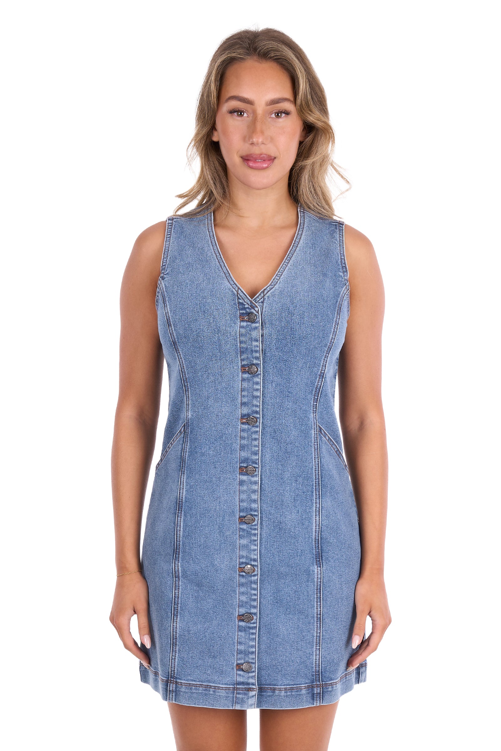 A woman modeling a sleeveless light blue denim mini dress with a button-down front, photographed against a plain white background.