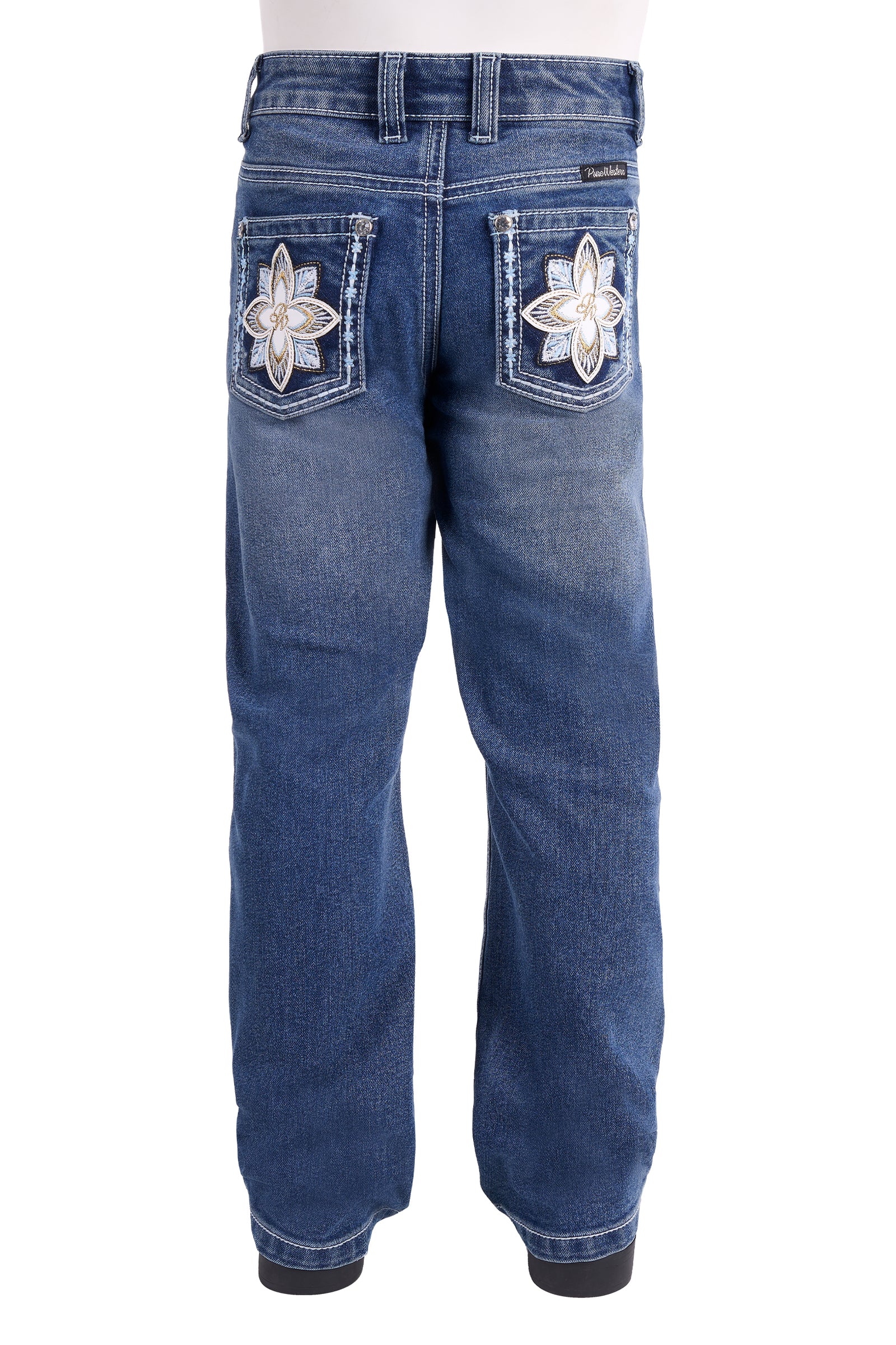 Rustic blue denim jeans shown from the back, featuring large white embroidered flower patches on the back pockets.
