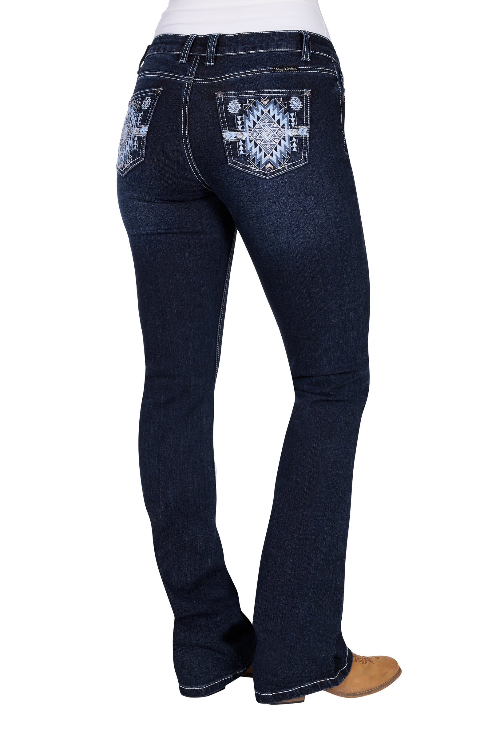 Pure Western Women's Lyn Relaxed Rider Jean. Dark blue jeans with decorative patches on a white background