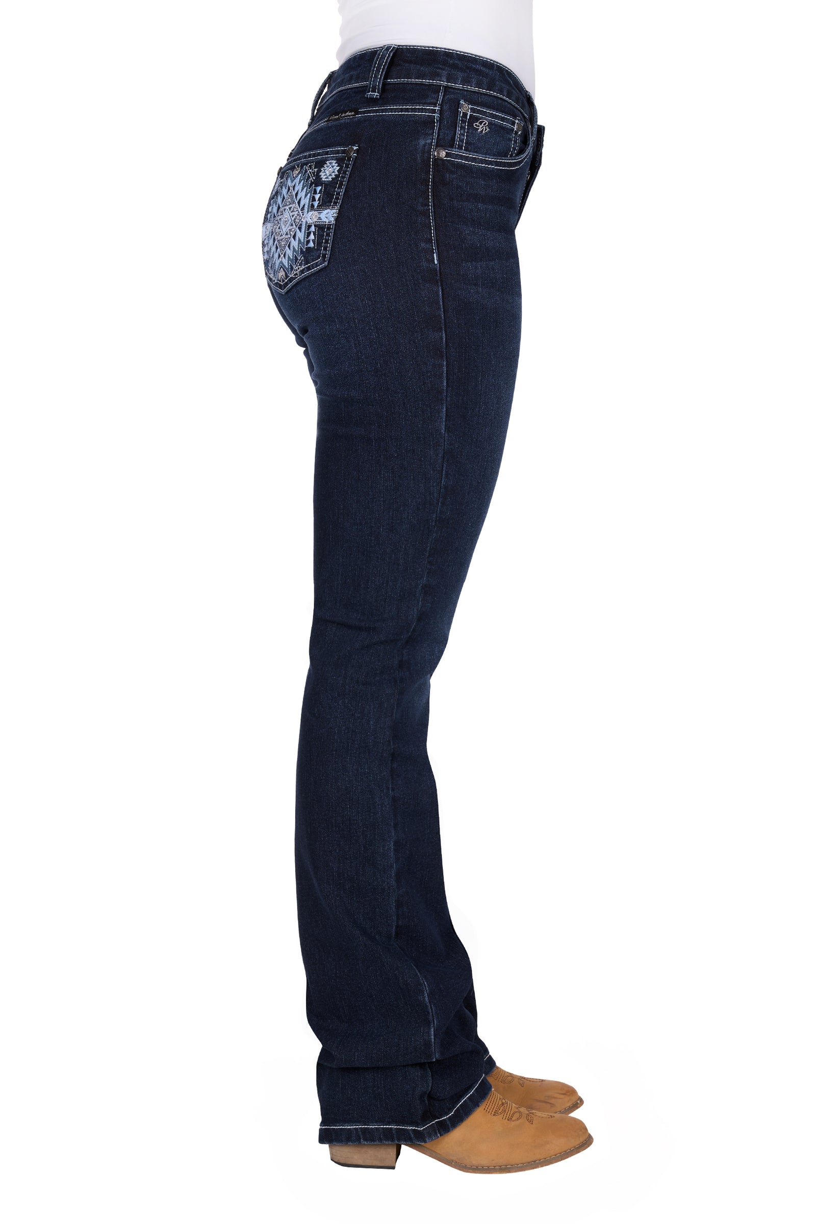 Pure Western Women's Lyn Relaxed Rider Jean. Dark blue jeans worn by a person on a white background