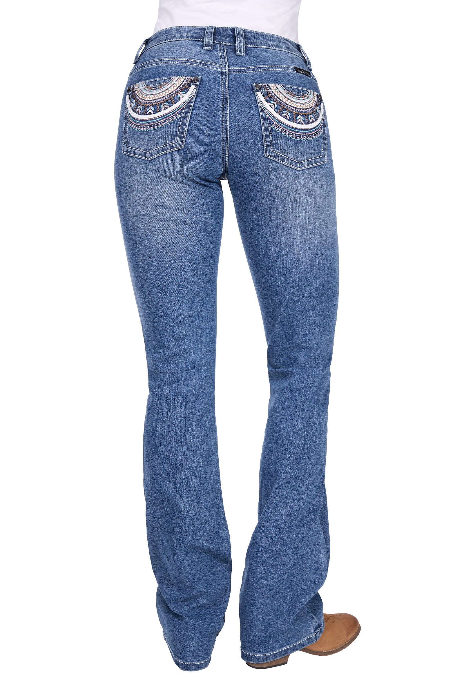 Blue jeans with decorative stitching on the back pockets against a white background