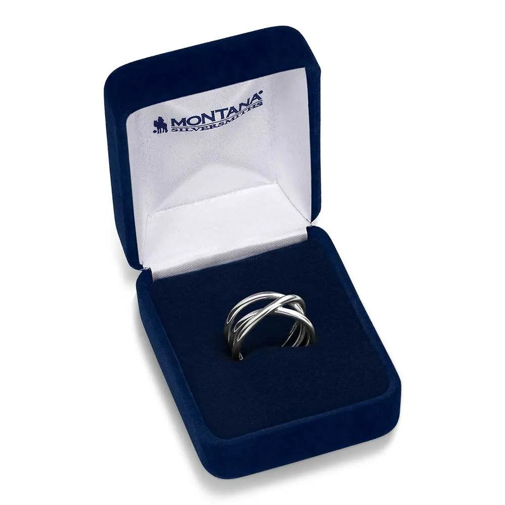 Silver ring in a blue jewelry box with 'Montana Silversmiths' branding.