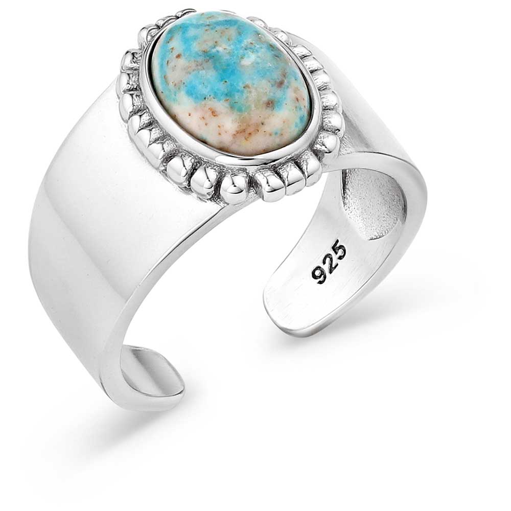 Montana Silversmiths Heavenly Panorama Open Ring. An open silver ring with an oval-shaped turquoise stone pendant, with the number 925 visible on the band.