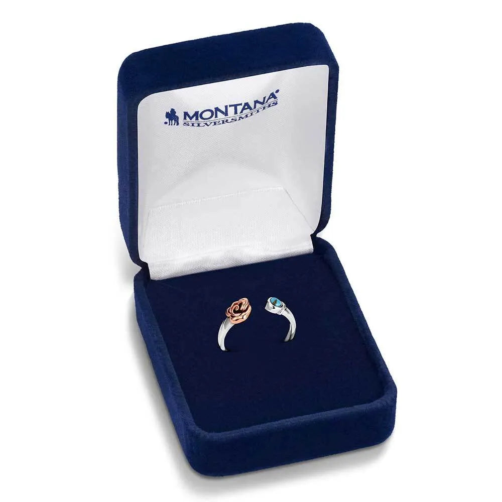 Two silver rings in a blue jewelry box with 'Montana Silversmiths' branding.