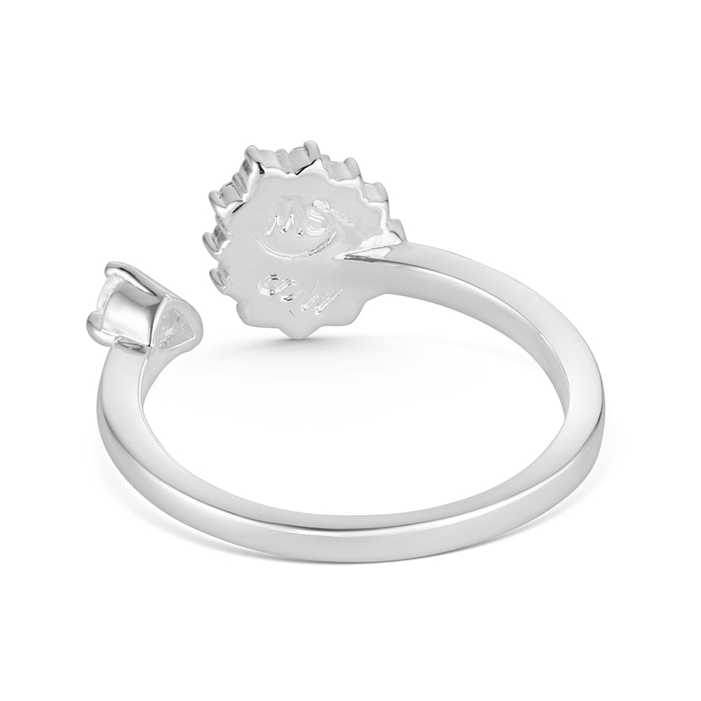 Silver ring with a sun-shaped clasp on a white background