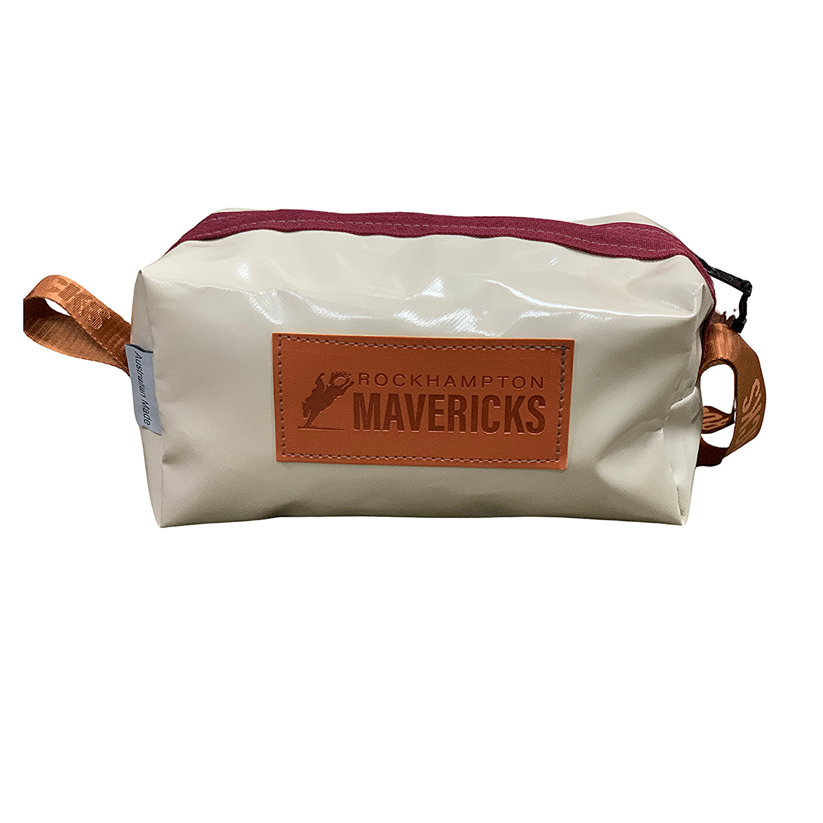 A toiletry bag with a white and red color scheme, featuring a logo that reads 'ROCKHAMPTON MAVERICKS' on the front, and a brown strap.
