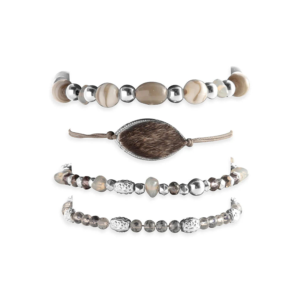 Set of three beaded bracelets with varying designs on a white background