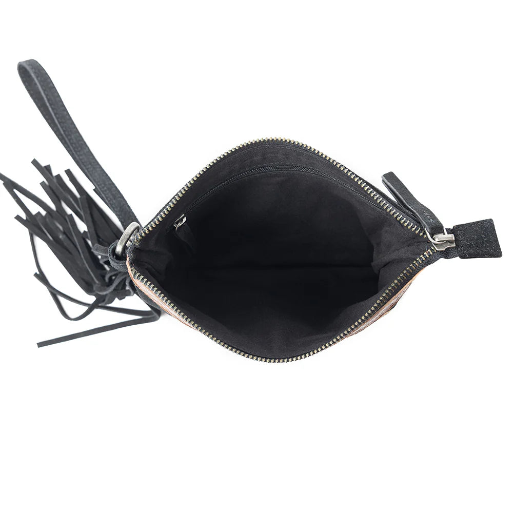 Desert Wing Crossbody Bag In Black. Black clutch bag with tassels on a white background