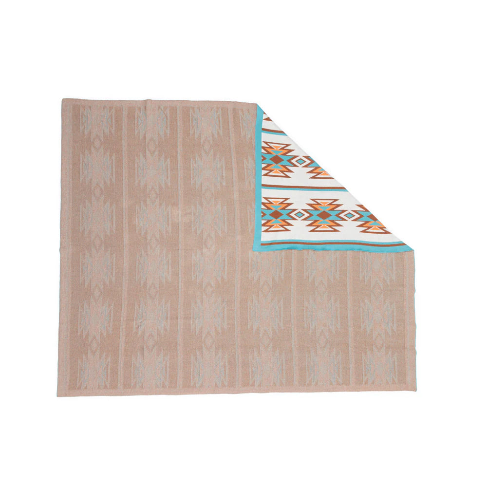 Beige patterned blanket with turquoise and orange accents on a white background
