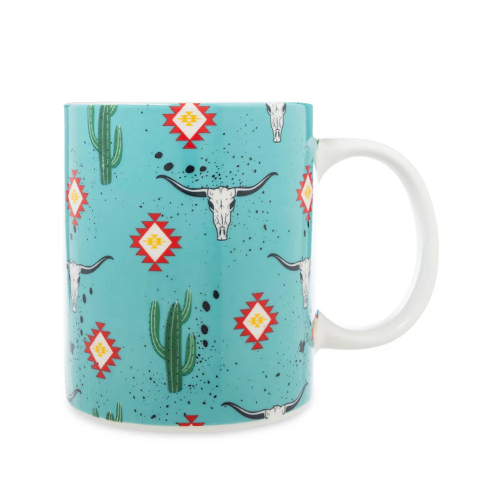 Sippin’ in the South Ceramic Mug in Cactus Geometry. Mug with southwestern design featuring cacti, longhorns, and geometric patterns on a blue background.