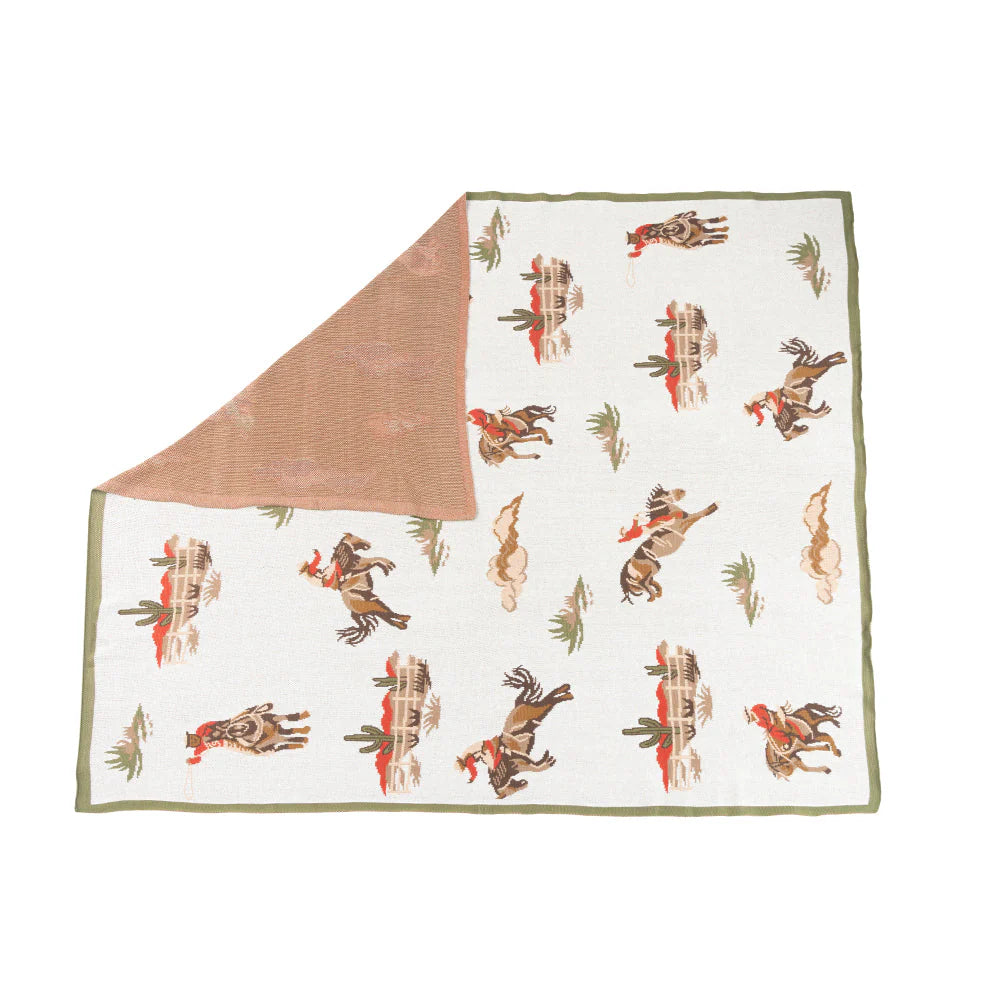 Blanket with cowboy pattern on a white background