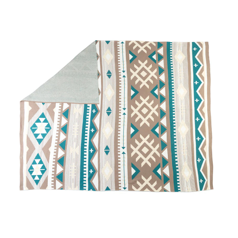 Patterned blanket with geometric design on a white background