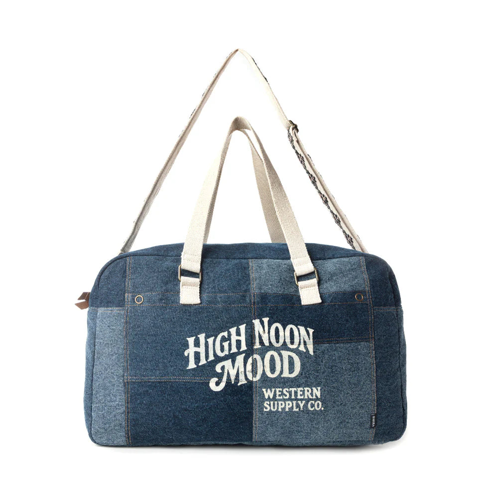 Blue duffel bag with 'High Noon Mood' text on a white background