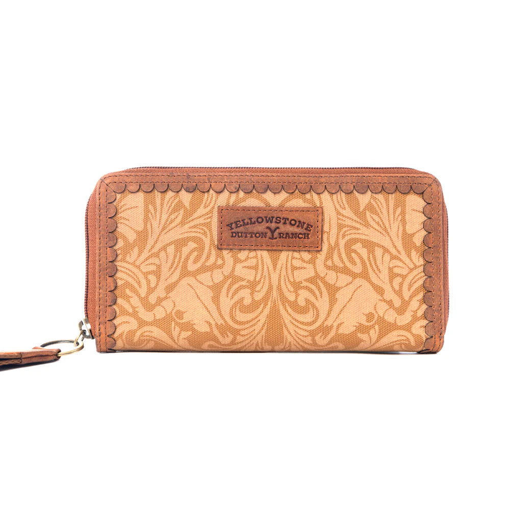 Yellowstone Montana Amber Wallet. Brown leather wallet with intricate pattern and 'Yellowstone Dutton Ranch' logo on a white background