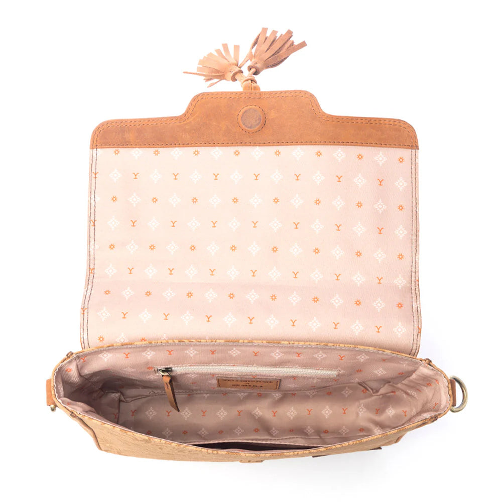 Yellowstone Sierra Amber Tassle Crossbody Bag. Open beige handbag with polka dot interior on a white background