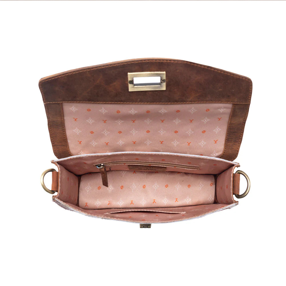 Brown leather handbag with gold hardware on a white background