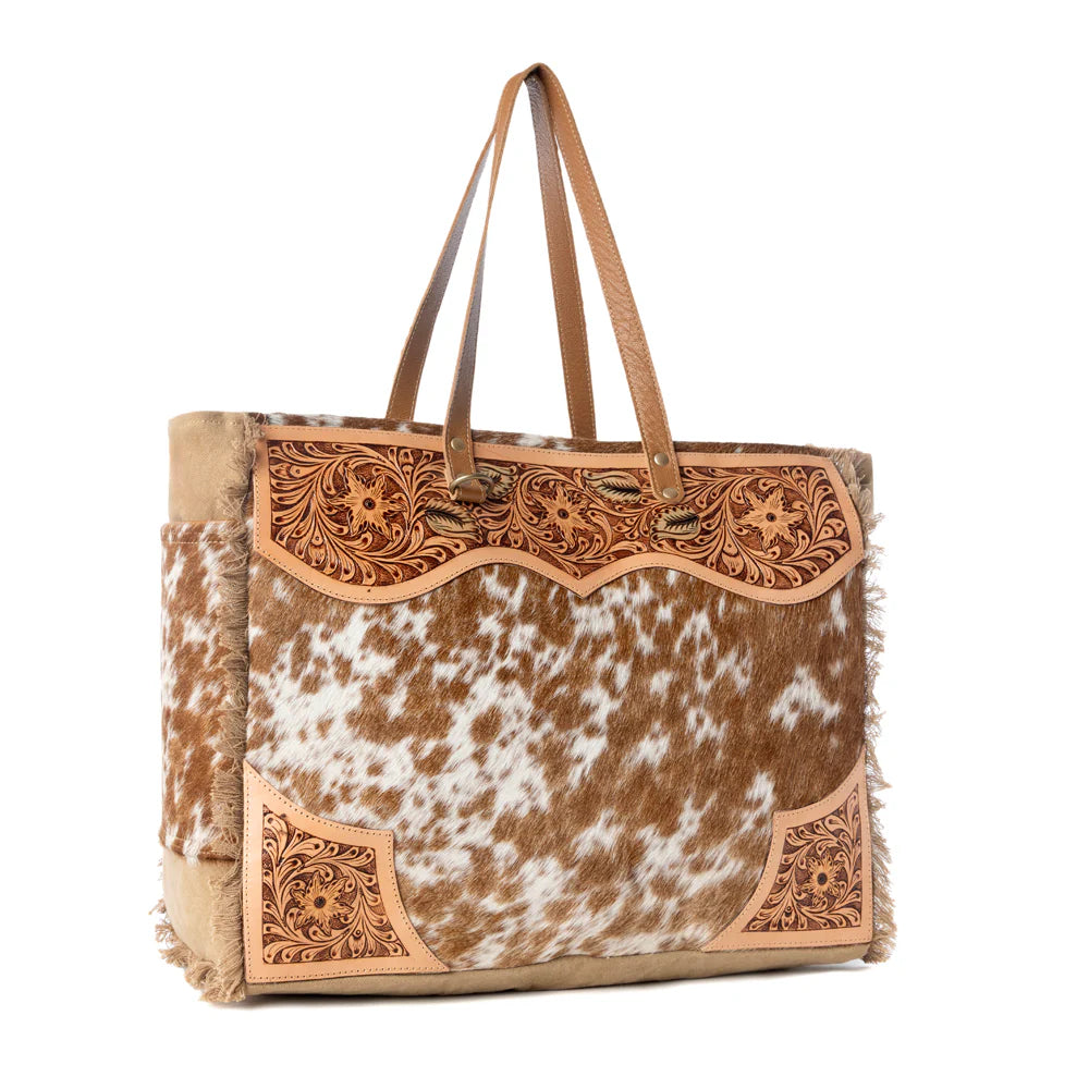 Tote bag with cowhide leather design on a white background