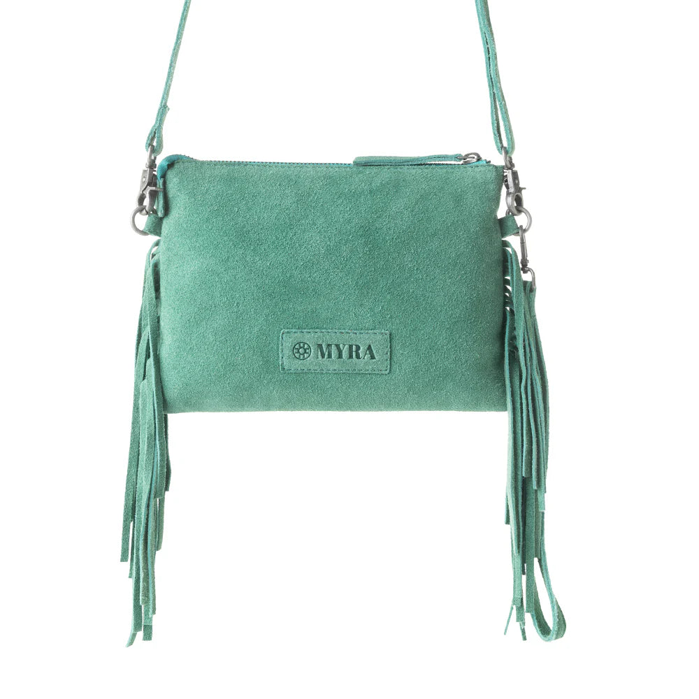 Green suede handbag with fringes and 'MYRA' branding on a white background