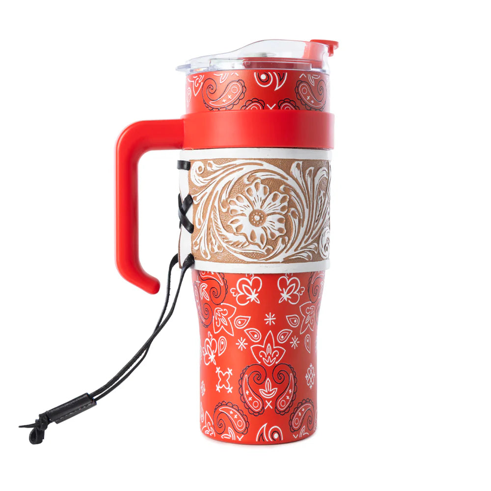 Red travel mug with paisley pattern on a white background
