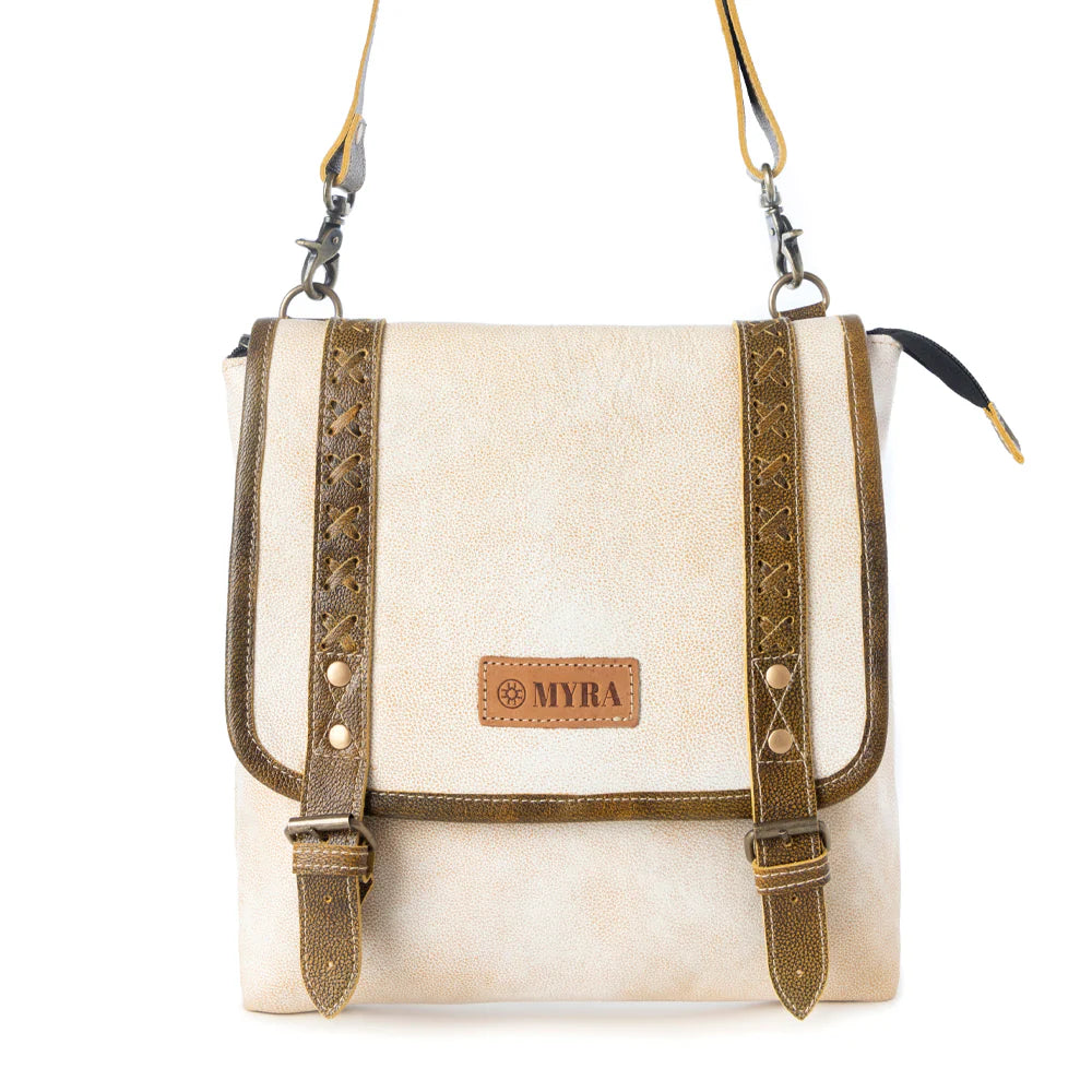 White crossbody bag with brown straps and 'MYRA' brand logo on a white background
