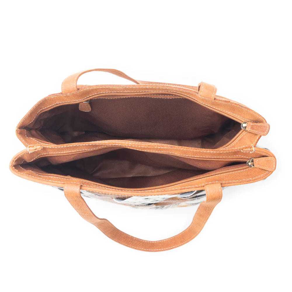 Brown leather handbag with open top on a white background