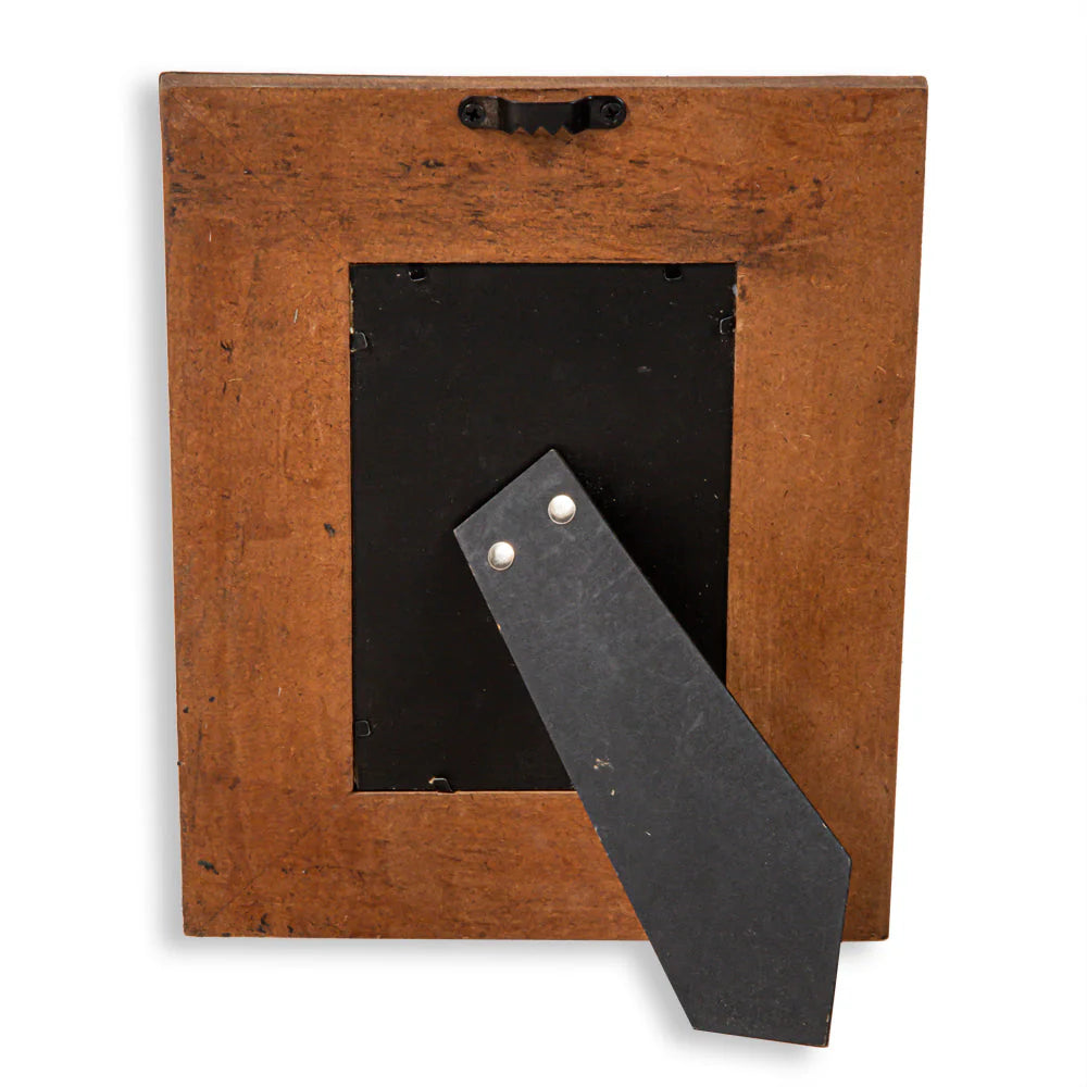 Time of Traditions Hand-Tooled Photo Frame. Brown wooden frame with a black leather strap inside.