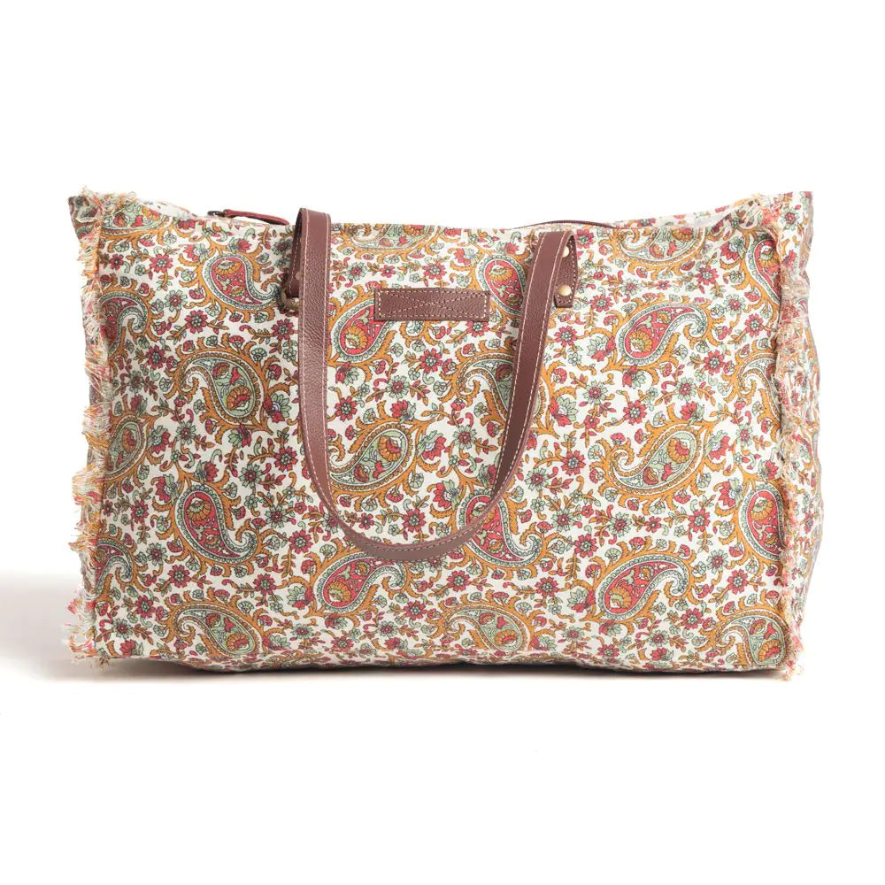 Women's Paisley Pointe Weekender Bag. A paisley patterned weekender bag with brown leather straps and details.