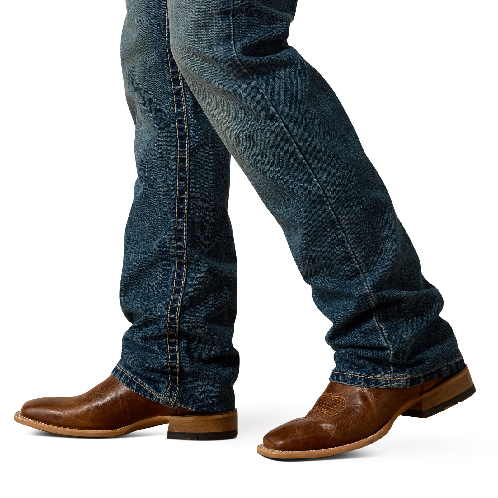 Ariat Men's M5 Boundary Straight Leg Jean. Blue jeans and brown leather boots on a white background