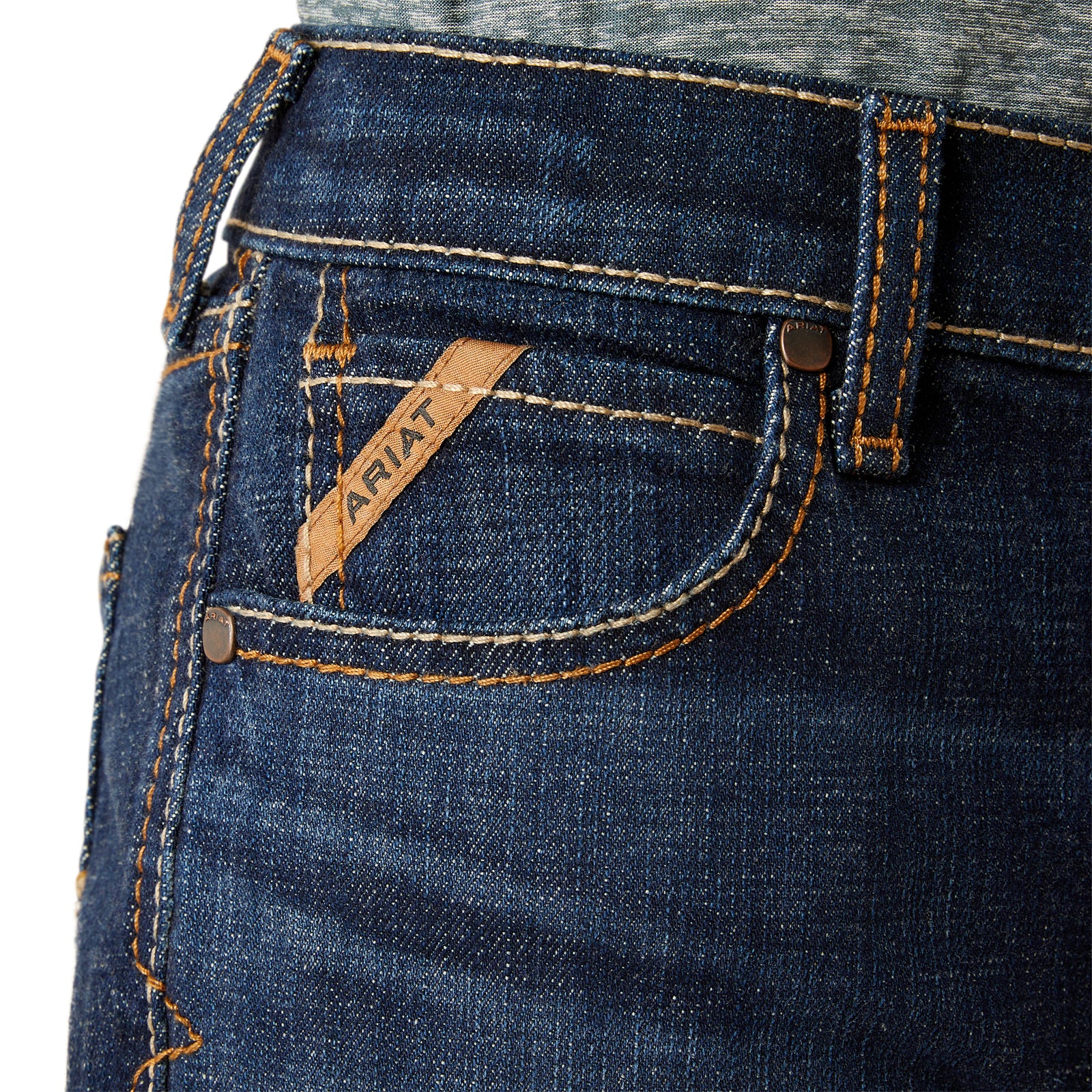 Ariat Boy's B4 Rolland Relaxed Fit Jean. Close-up of blue jeans with Ariat logo on pocket