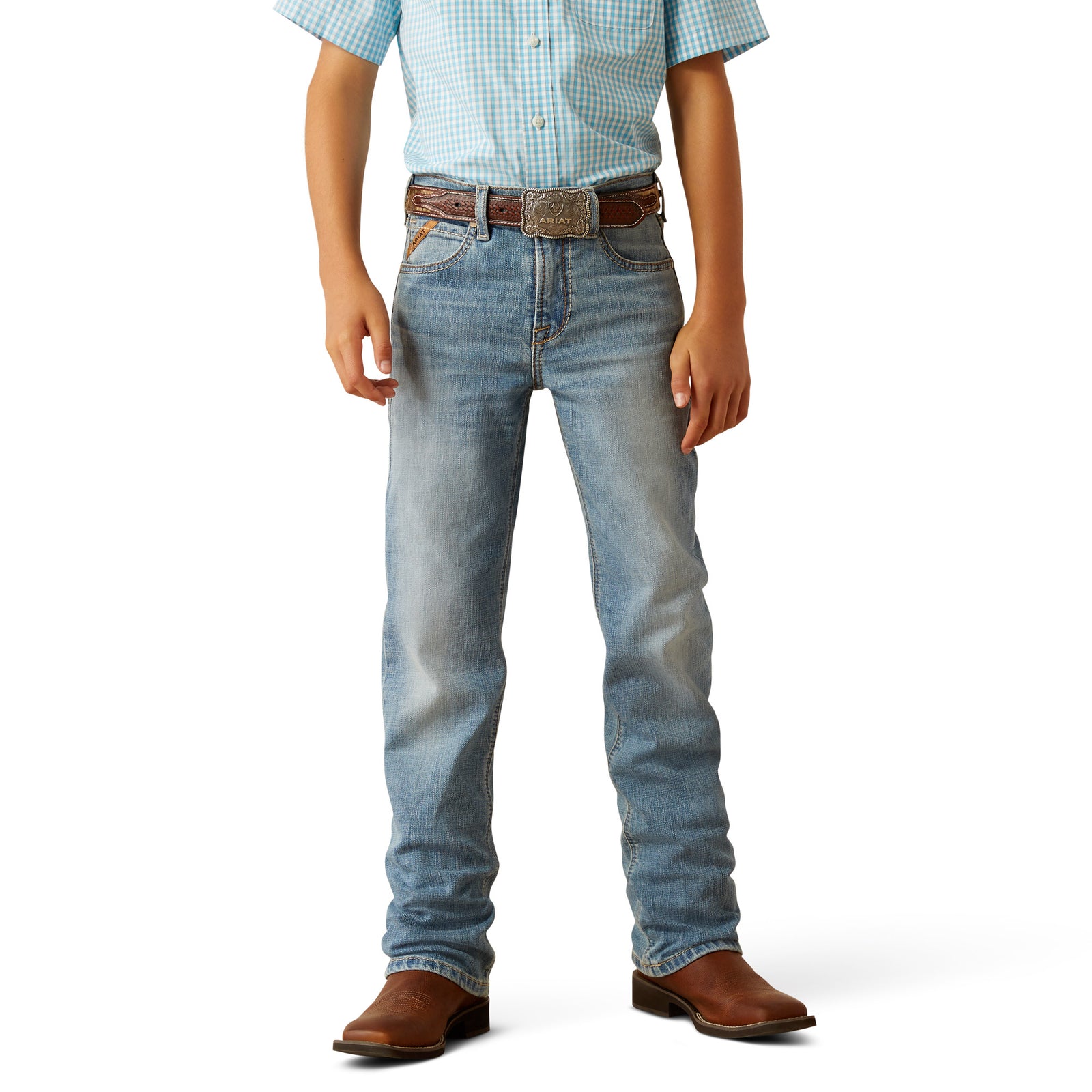 Ariat Boy's B4 Relaxed Jones Boot Cut Jeans. Person wearing light blue jeans and a checkered shirt on a white background