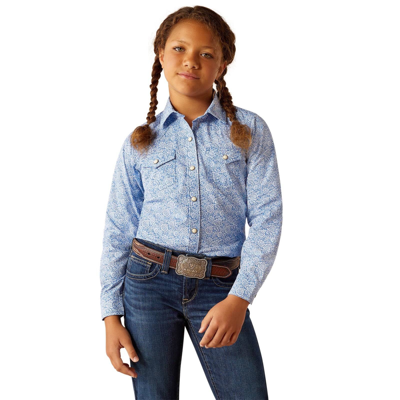 Ariat Girl's Shannon L/S Snap Western Shirt. Young girl wearing a blue patterned shirt and jeans on a white background