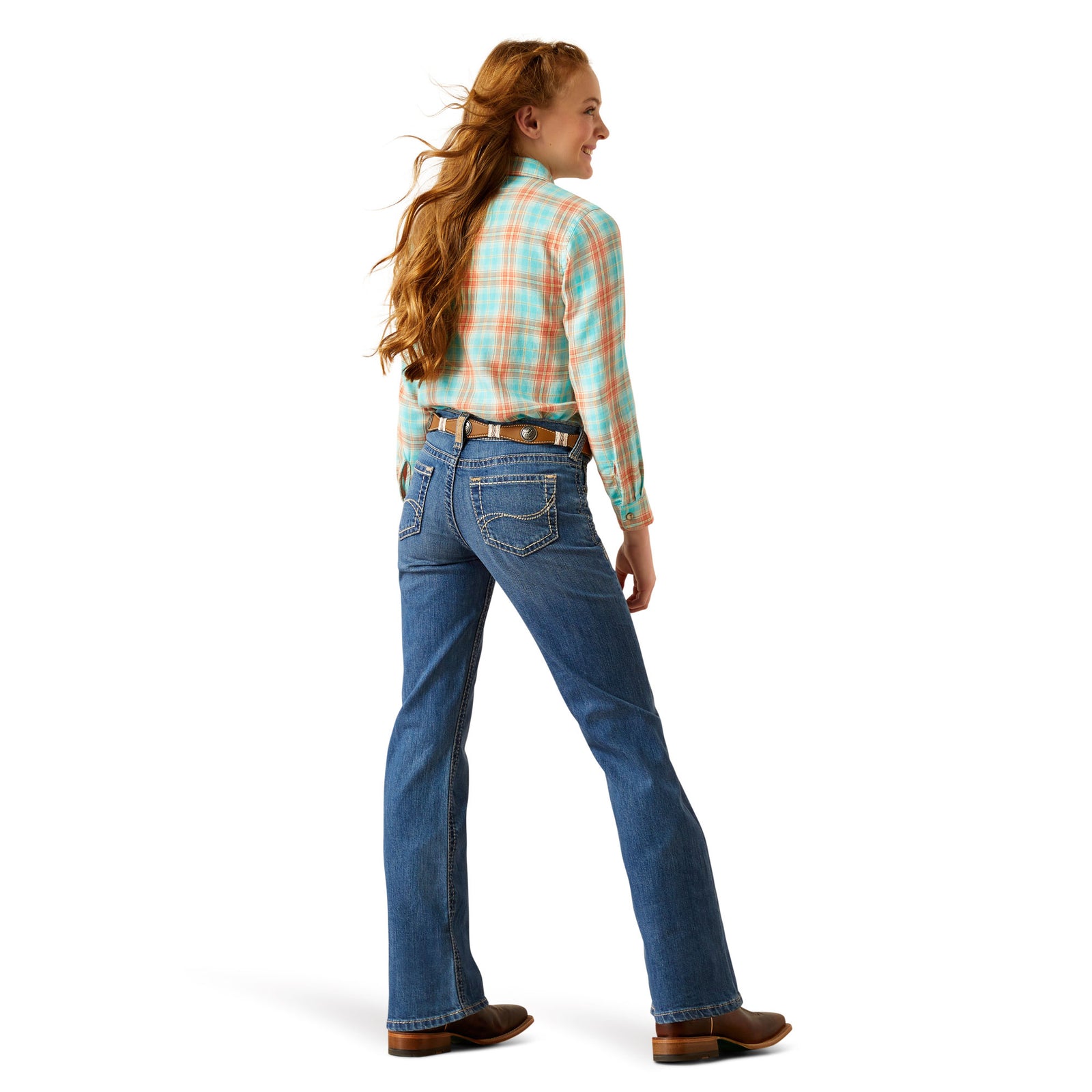 Ariat Girl's Lilla Boot Cut Jeans. Girl wearing blue jeans and a plaid shirt on a white background