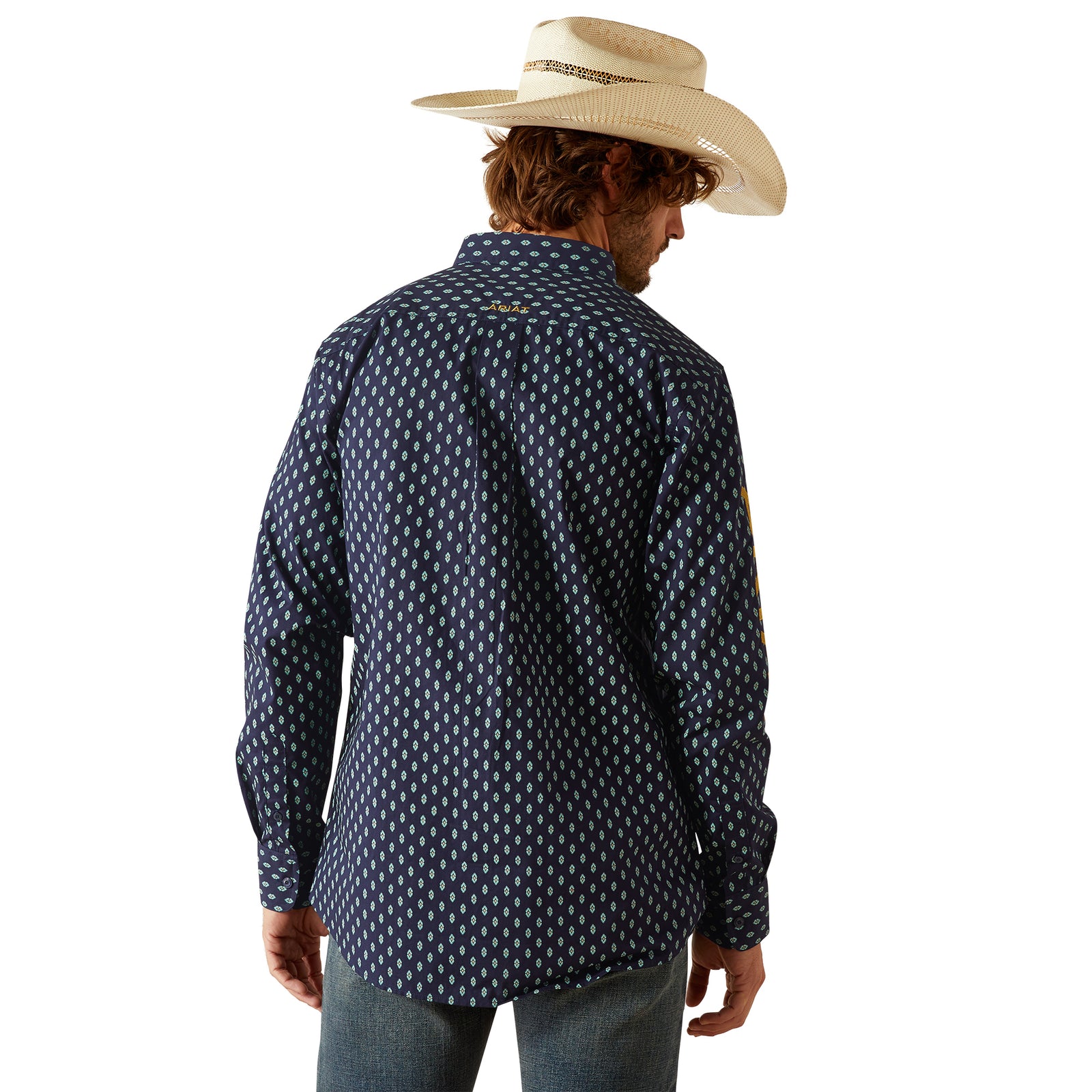 Ariat Men's Team Powell Fitted L/S Western Shirt. Man wearing a navy patterned shirt and straw hat on a white background
